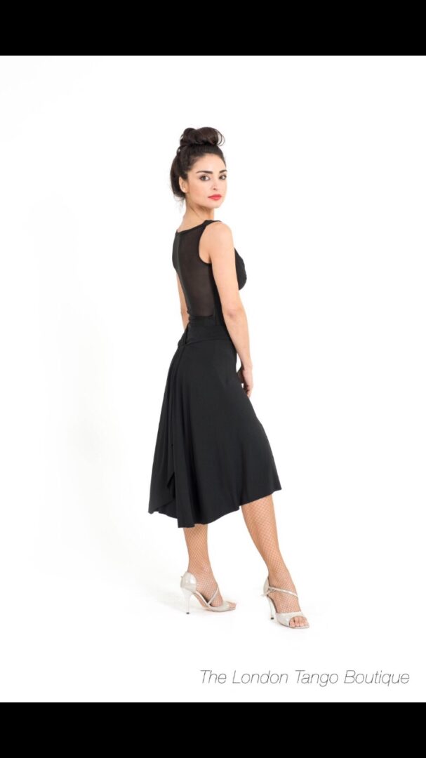 A black top and skirt side view