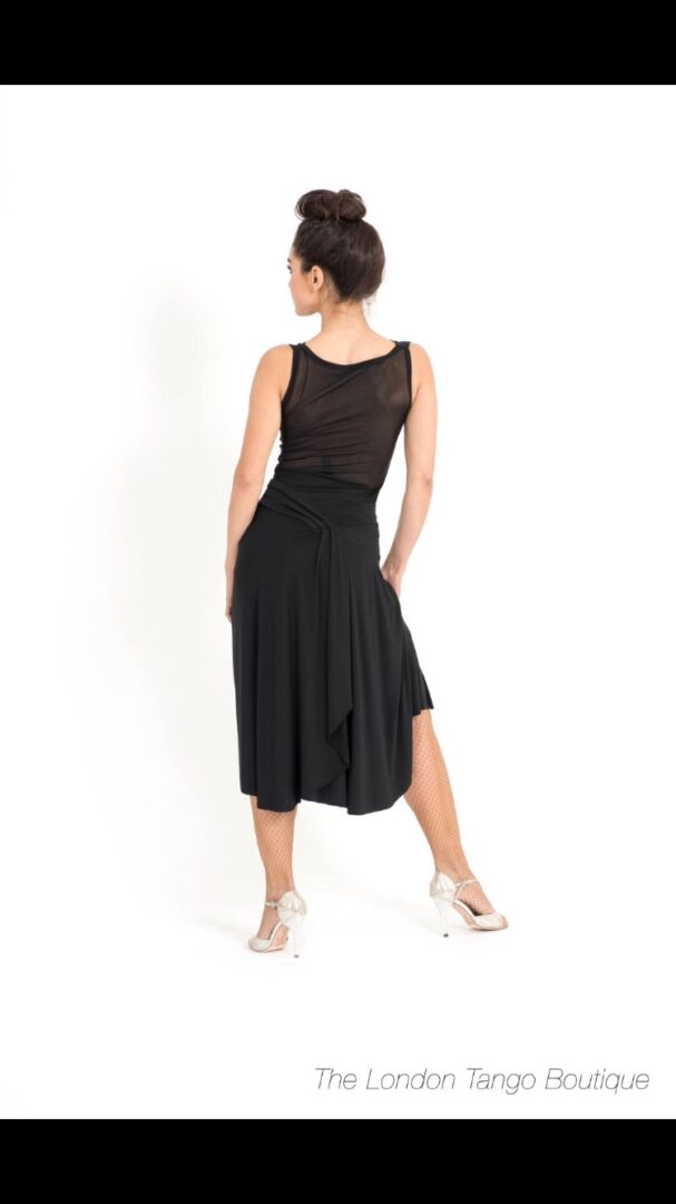 A lady wearing black tango see through dress