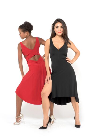 Two women in red and black dress showing dance moves