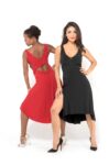 Models wearing red and black tango dresses and dancing