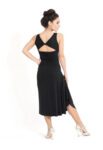 A black Tango dress with white heels back view