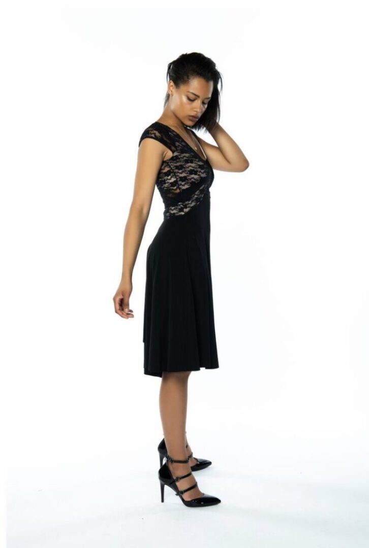 A side view of the black v tango dress