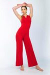 A woman in a beautiful red Tango apparel raising her arms