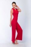 Model posing in red dance tango jumpsuit without sandal
