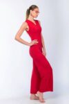 Model posing in red dance tango jumpsuit with red glasses