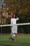 A woman holding a tennis racket