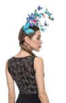 A close-up image of a glitter butterflies tango top with headpiece